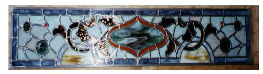A kind of oceanic theme defines this stained glass transom