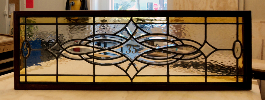 Clear and tinted glass fit together beautifully in this doorway stained glass transom